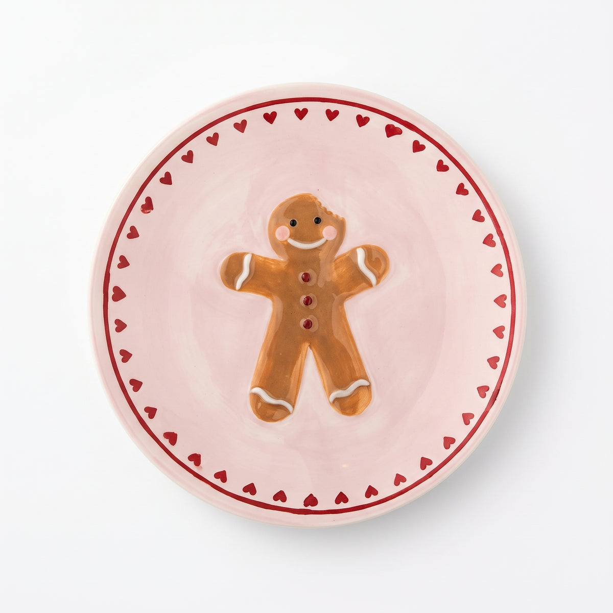 Kleines Steingut-Teller Binna in Rosé mit handbemaltem Lebkuchen-Motiv auf weißem Hintergrund.